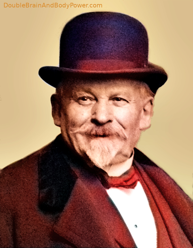 Color picture of smiling Émile Coué in a brown and black coat and hat, and white shirt.