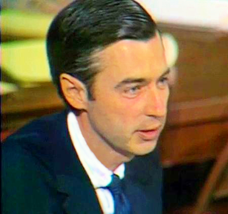 Fred Rogers of Mister Rogers' Neighborhood in suit and tie.