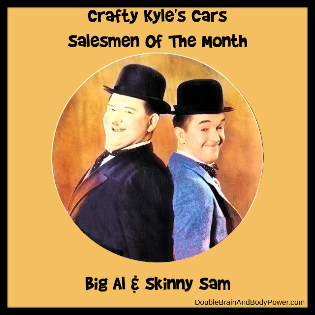 Laurel and Hardy as Big Al and Skinny Sam, two car salesmen. They are in a color picture for Crafty Kyle's Cars that proclaims then as Salesmen Of The Month. Both are dressed in suits with hats on.